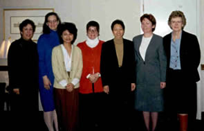 6 women nurses standing in a conference room